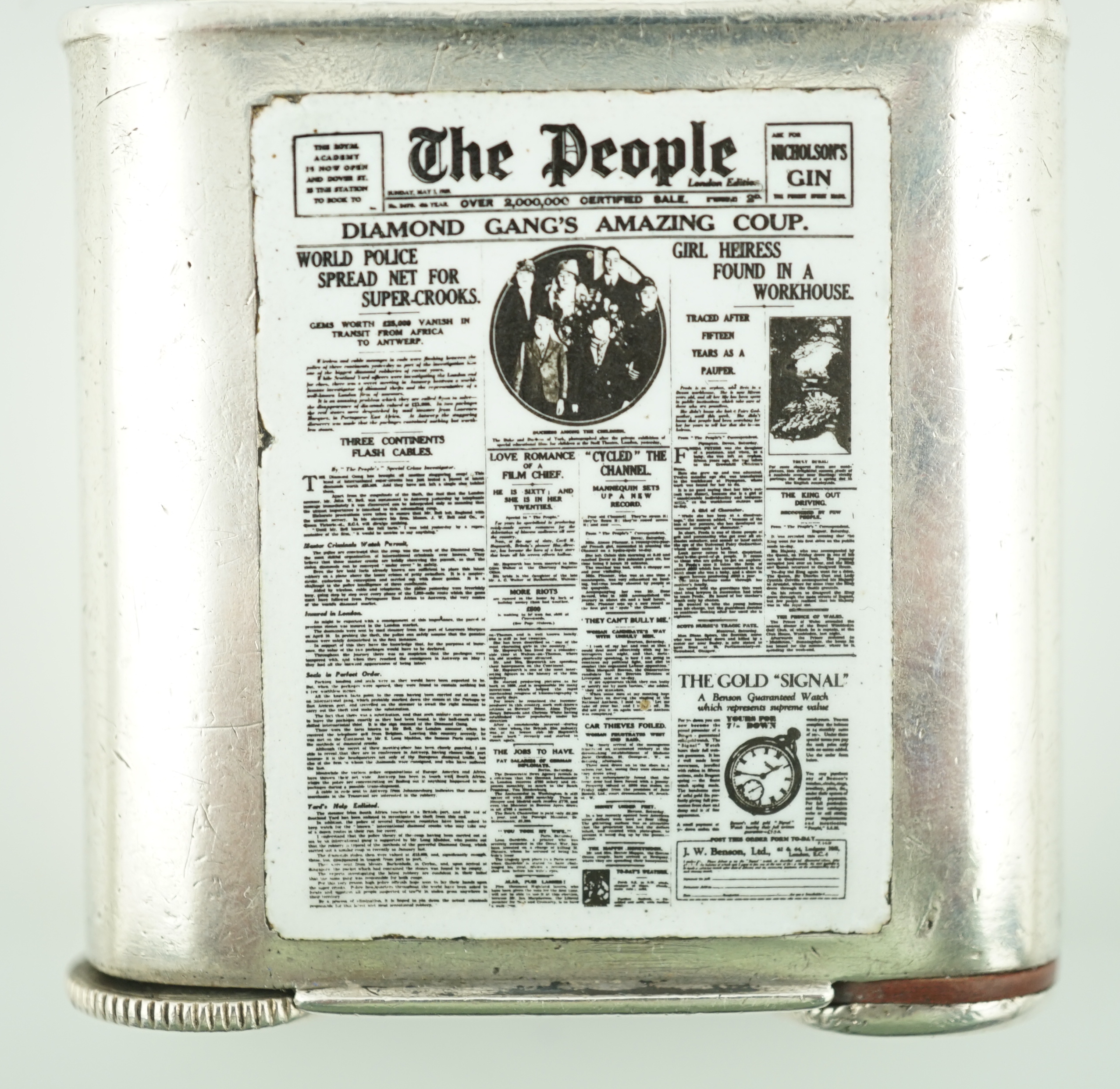 A George V silver novelty lighter, with two colour enamelled panel of 'The People' newspaper front cover dated May 5th, 1929